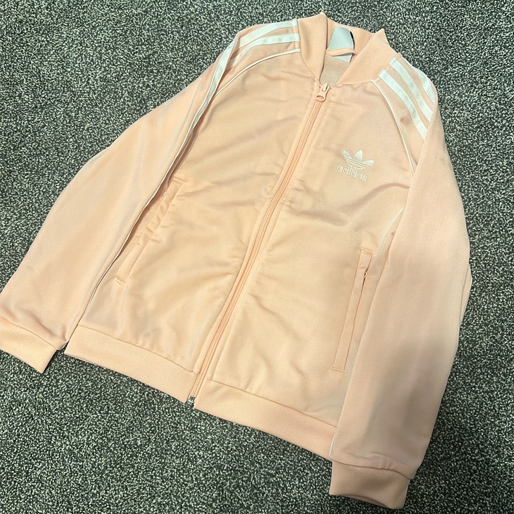 Girls pink adidas track jacket size 7-8Y. Kept in excellent condition.